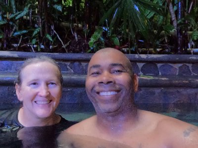 Relaxing in the stone thermal pools surrounded by lush rainforest landscaping at Baldi Hot Springs.