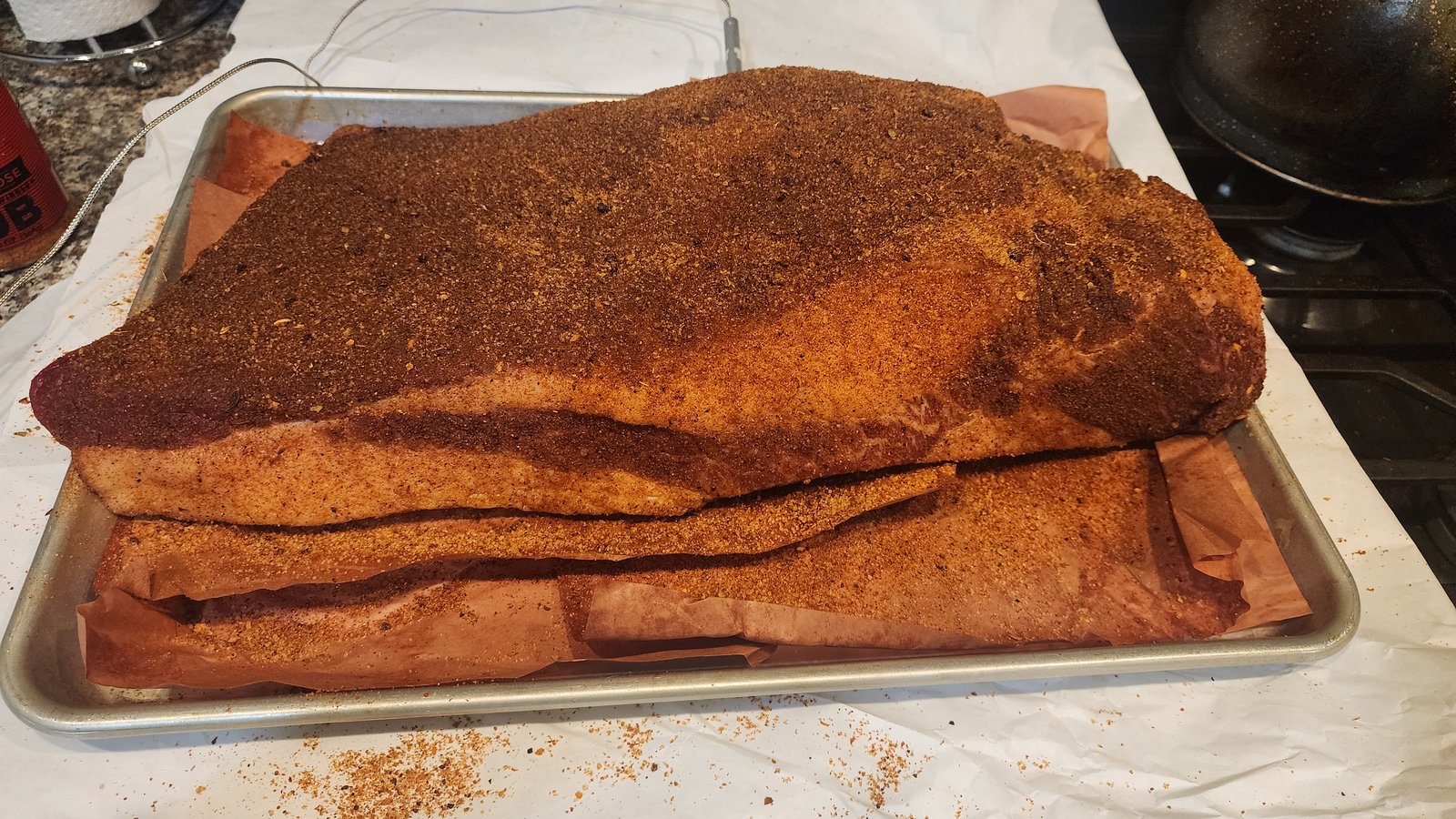 resh trimmed 10-pound whole brisket on a baking sheet before adding rub.